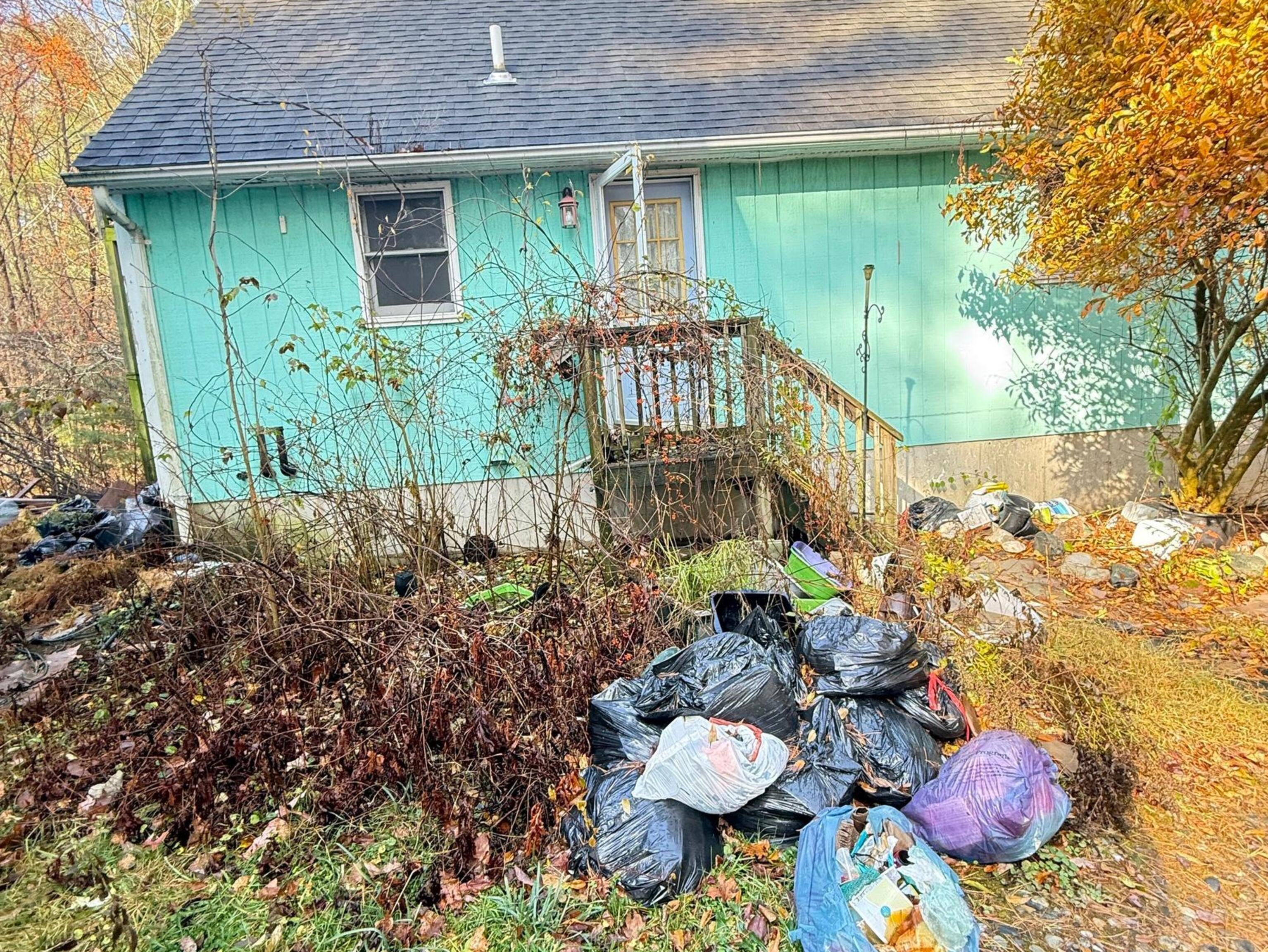 41 Delphi Road Stafford, CT 06076 - Photo 3 of 16 a view of a backyard with plants and a garden