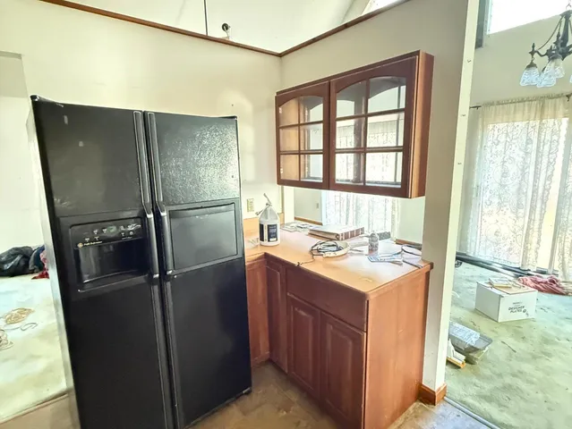 a kitchen with a sink stove and refrigerator