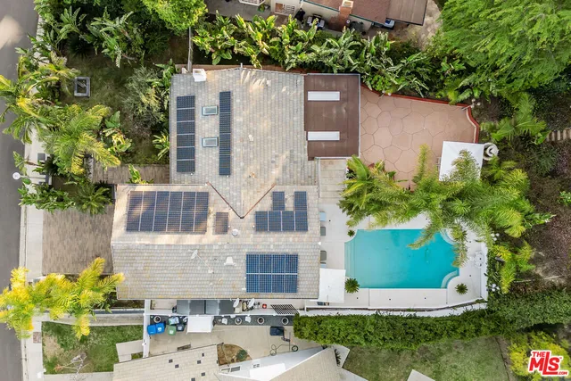 an aerial view of a house with outdoor space