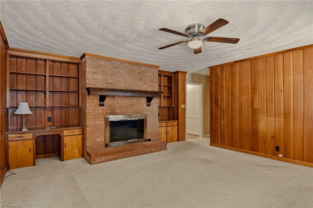 4325 Witherow Road Winston-Salem, NC 27106 - Photo 15 of 38 Cozy Den with gas fireplace & built-in bookcases
