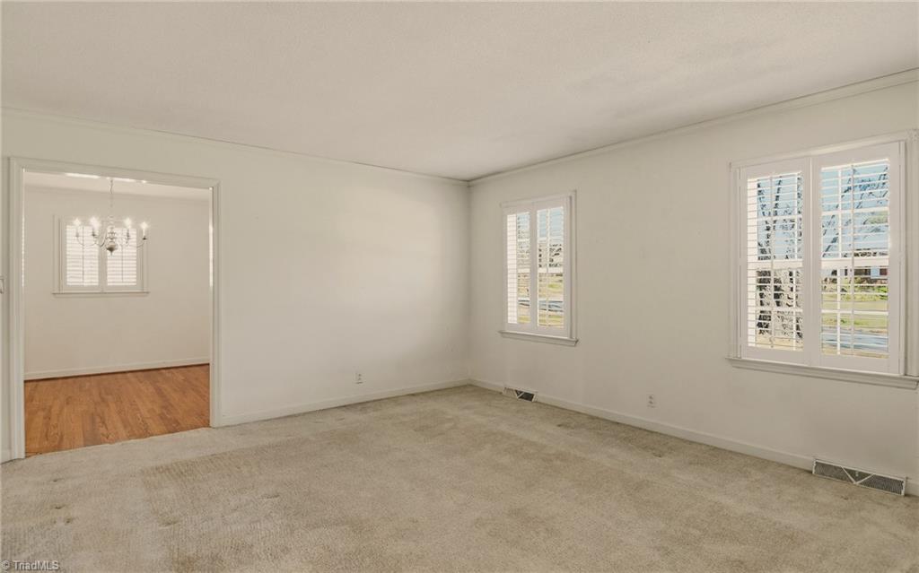 4325 Witherow Road Winston-Salem, NC 27106 - Photo 7 of 38 Easy flow into dining room. Plantation shutters throughout the house