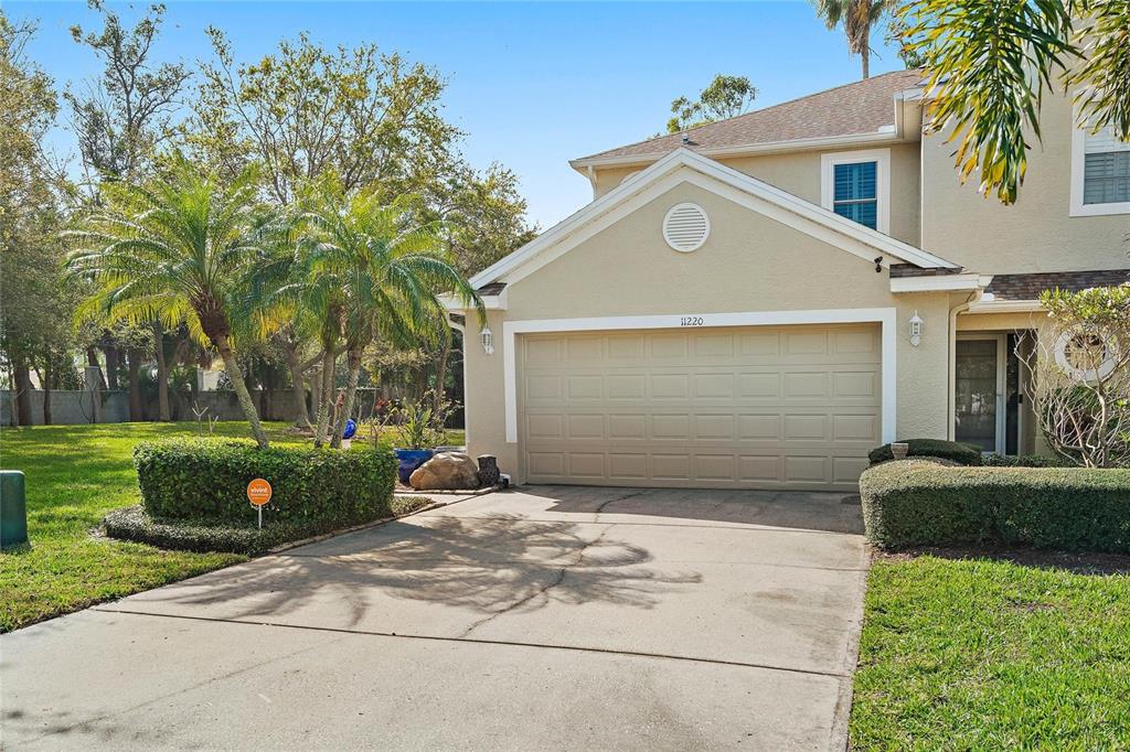 a view of a front of a house with a yard