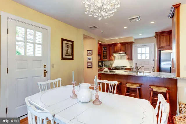 a dining room with a table or chairs and a dining table with wooden floor