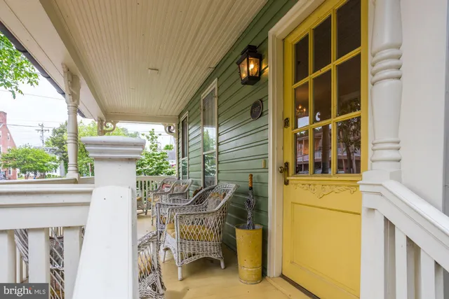 a view of a chair and table in the balcony
