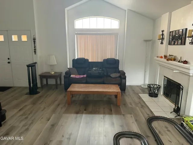 a living room with furniture and a fireplace