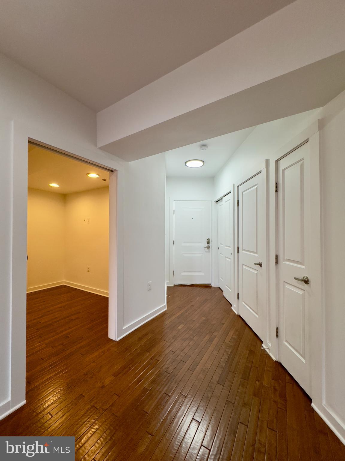 613 Portland Street, Unit 17 Baltimore, MD 21230 - Photo 12 of 12 a view of an empty room with wooden floor and closet