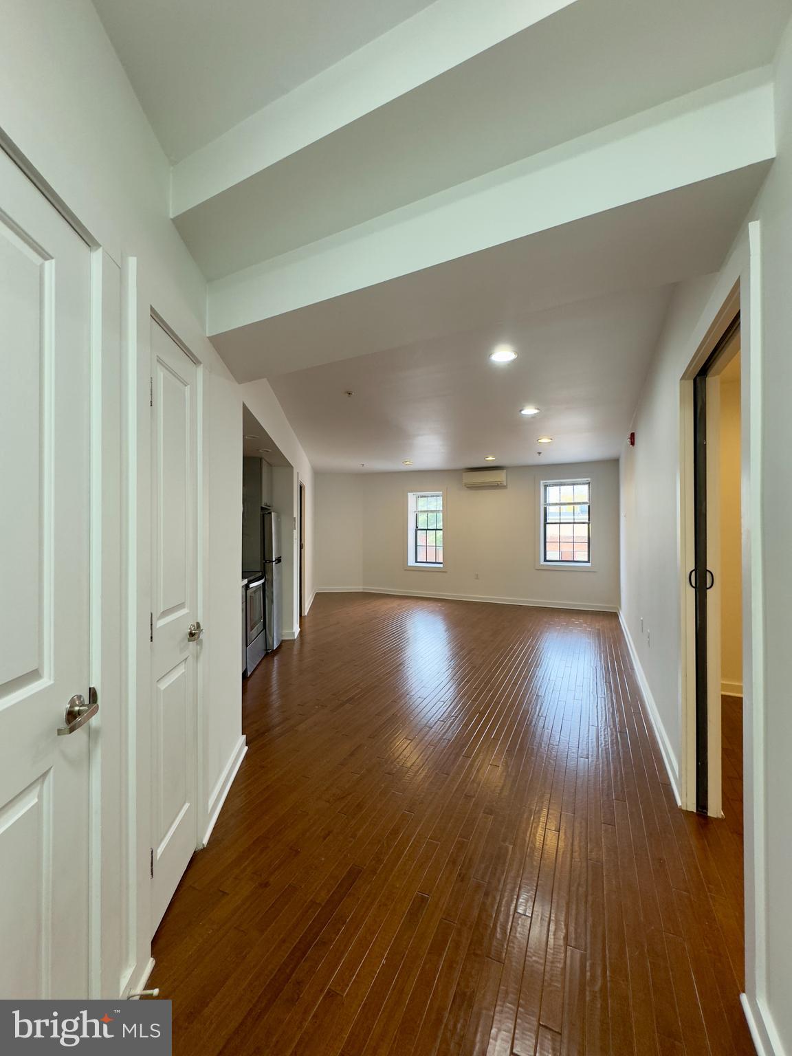 613 Portland Street, Unit 17 Baltimore, MD 21230 - Photo 3 of 12 a view of a hallway with wooden floor