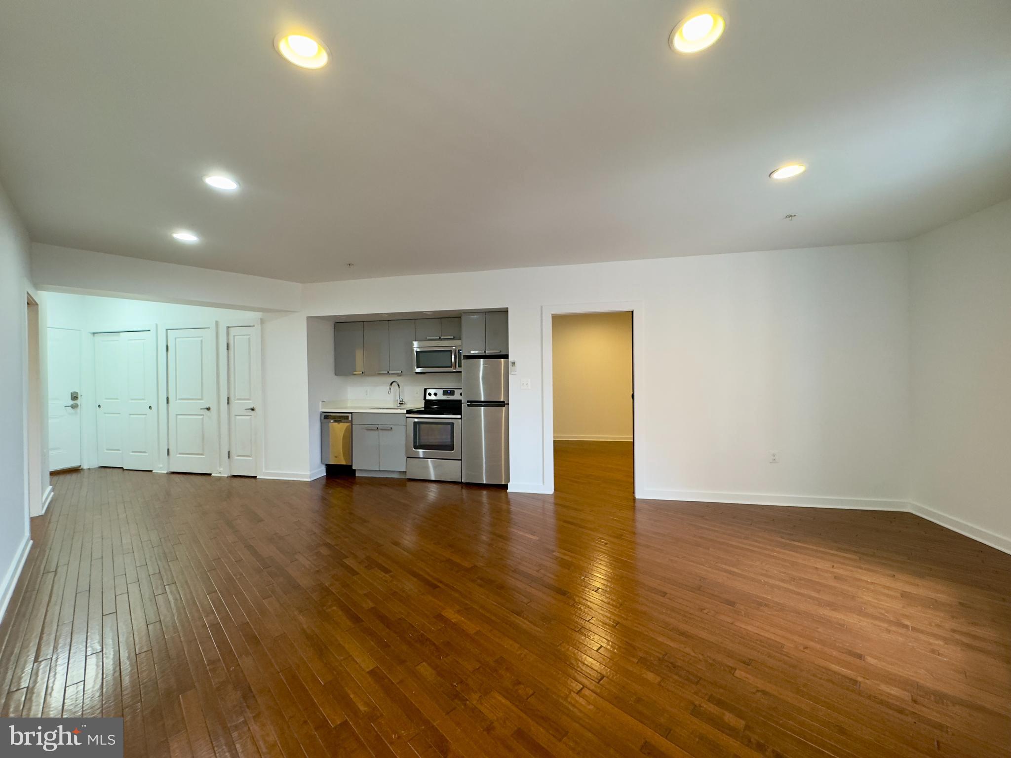 613 Portland Street, Unit 17 Baltimore, MD 21230 - Photo 5 of 12 a view of empty room with wooden floor