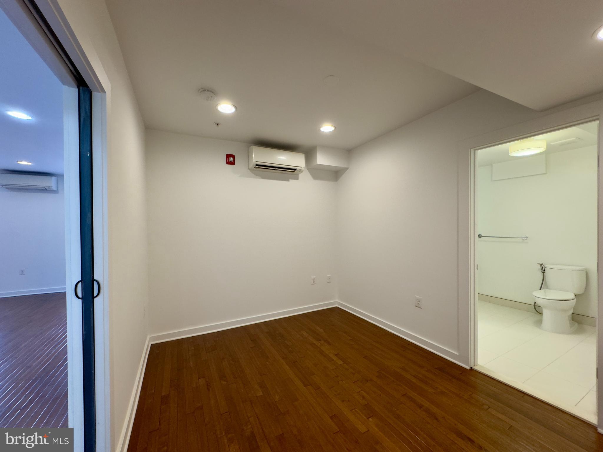 613 Portland Street, Unit 17 Baltimore, MD 21230 - Photo 6 of 12 a view of empty room with wooden floor