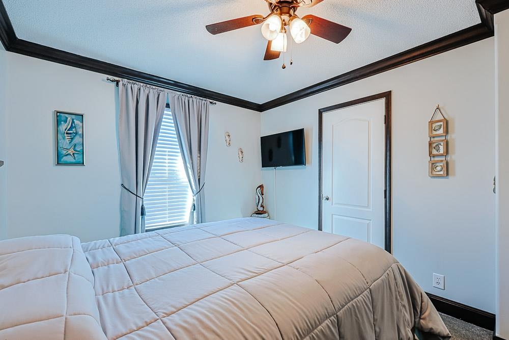 6773 Hampton Road Conway, SC 29527 - Photo 18 of 39 Bedroom with crown molding and a ceiling fan