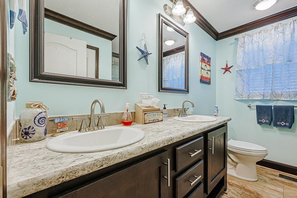 6773 Hampton Road Conway, SC 29527 - Photo 20 of 39 Bathroom featuring crown molding, double vanity.