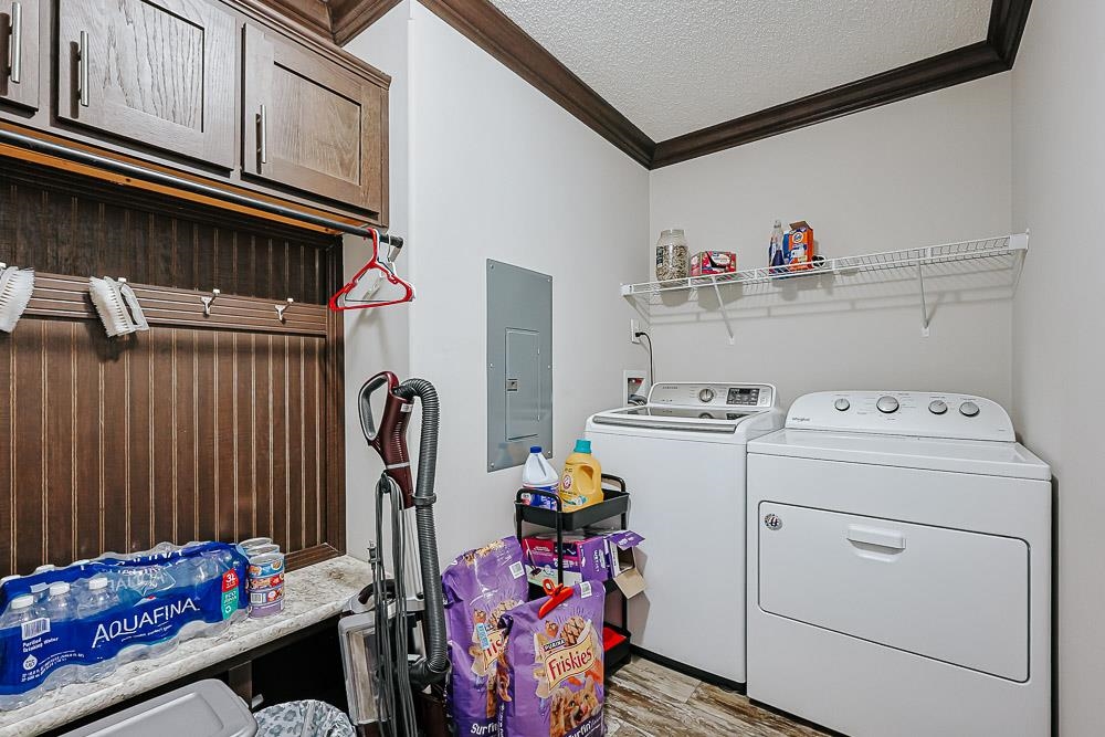 6773 Hampton Road Conway, SC 29527 - Photo 27 of 39 Laundry area with crown molding, a textured ceiling, electric panel, and washing machine and clothes dryer