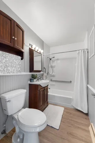 a bathroom with a sink a toilet and bathtub
