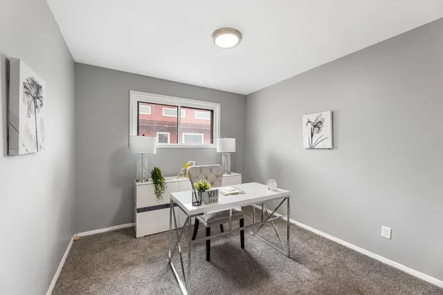 a workspace with furniture and window