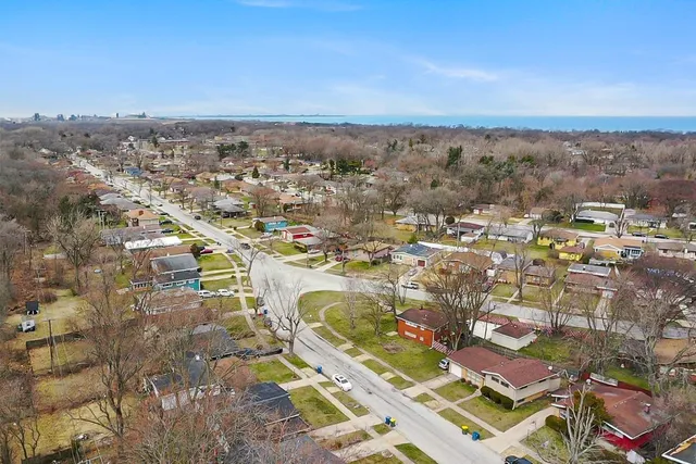 an aerial view of residential building and lake view