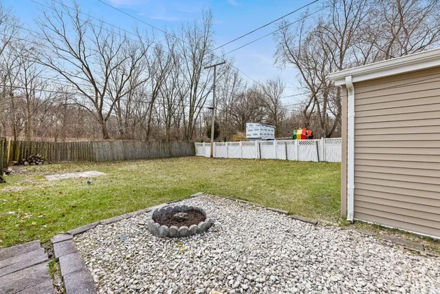 a view of a backyard with a small cabin