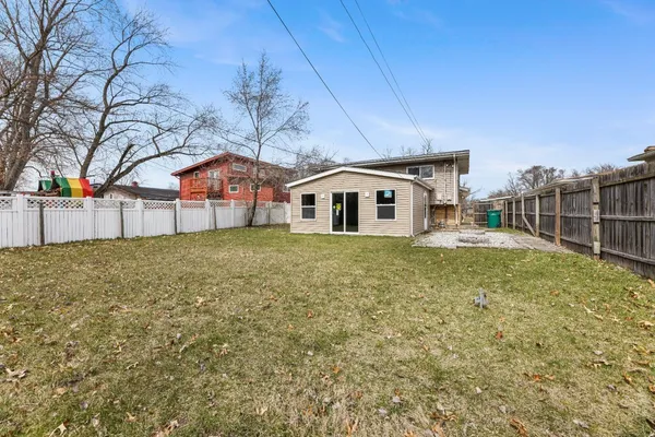 a front view of house with yard and trees