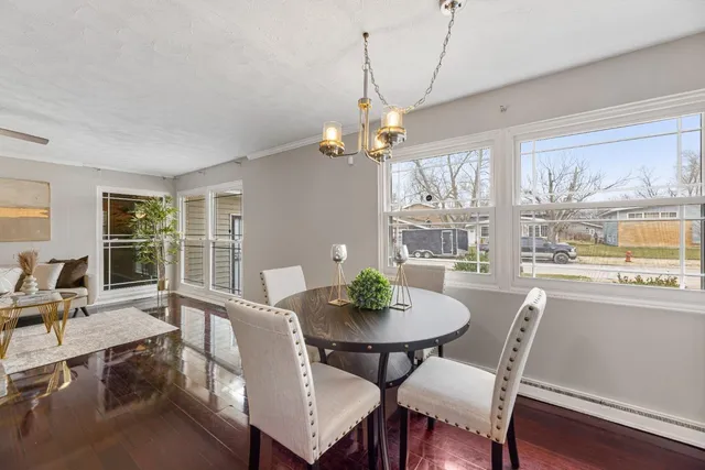 a view of a dining room with furniture window and outside view
