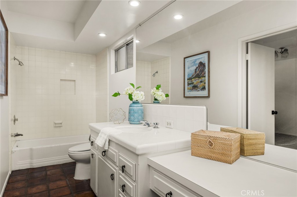 12011 Theta Road North Tustin, CA 92705 - Photo 29 of 49 The powder/guest bath off foyer includes a tub, shower and attached guest bedroom.