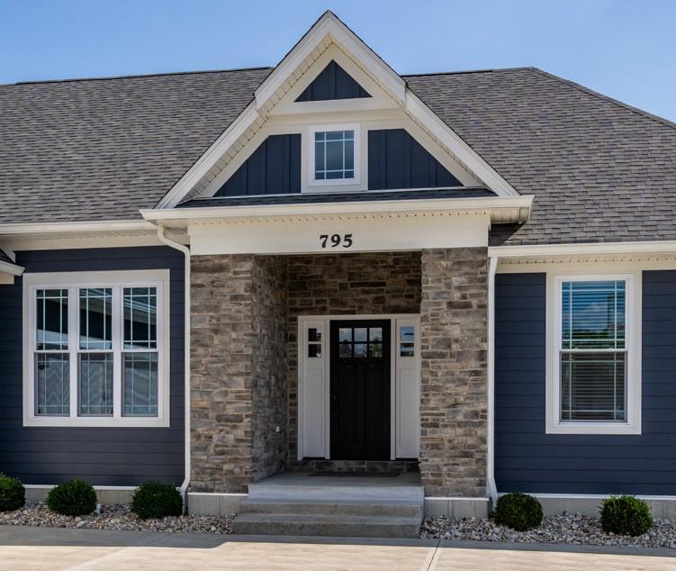 795 Madison Ridge Road Lawrenceburg, IN 47025 - Photo 2 of 72 Inviting front porch flanked by stacked stone columns provides an attractive protected entry.