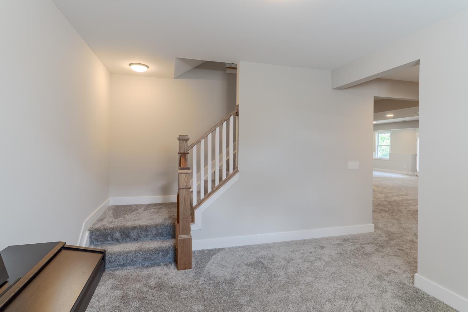 795 Madison Ridge Road Lawrenceburg, IN 47025 - Photo 39 of 72 At the bottom of the staircase is an open office area, which could be used for many things.