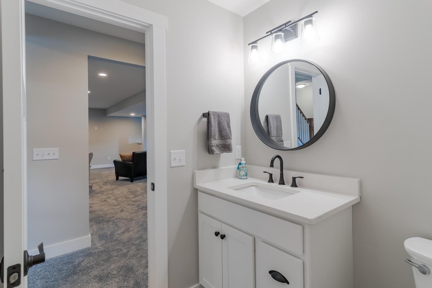 795 Madison Ridge Road Lawrenceburg, IN 47025 - Photo 45 of 72 Lower level powder room serves both the huge Family Room as well as Bedroom 4.