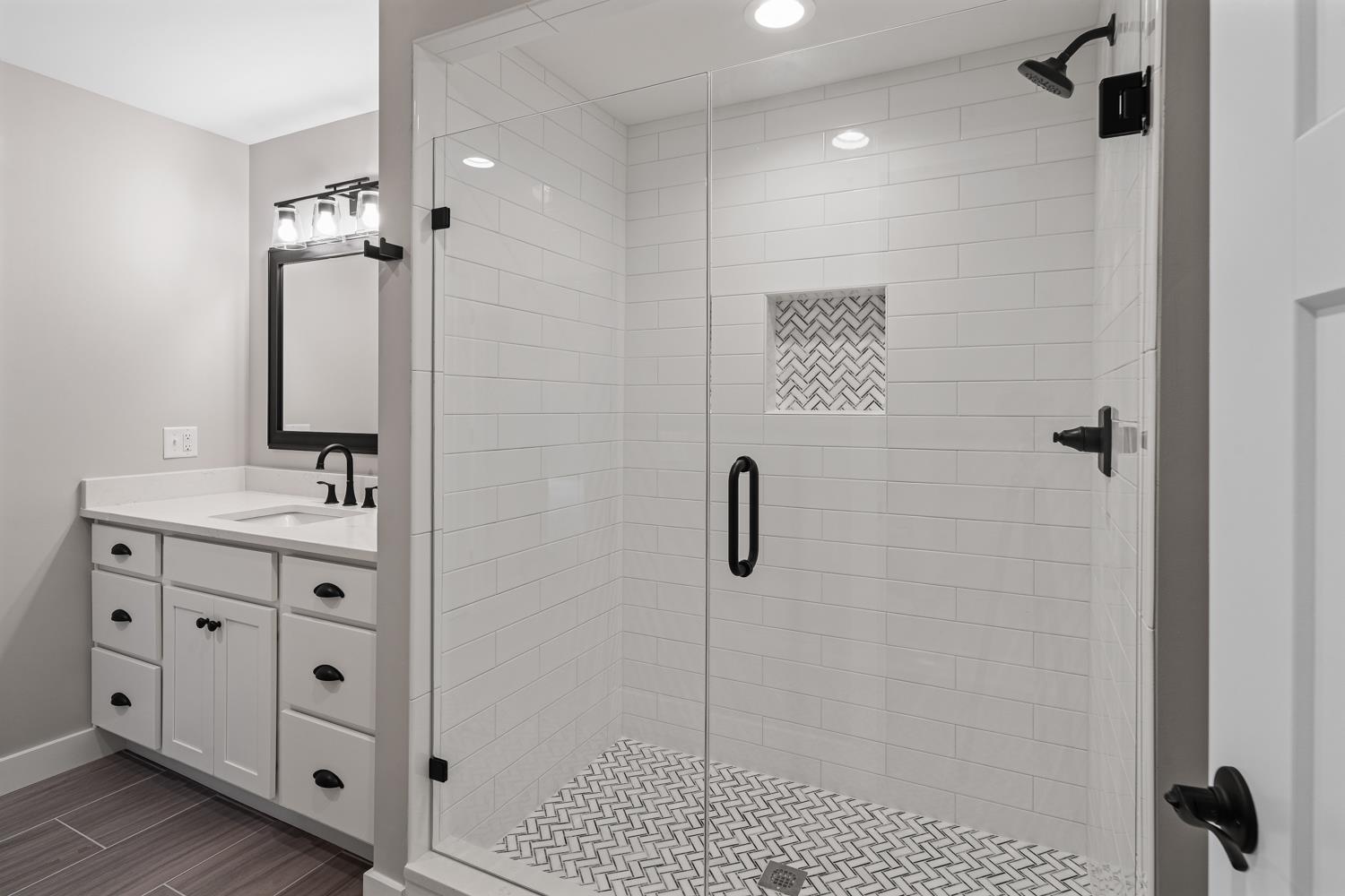 795 Madison Ridge Road Lawrenceburg, IN 47025 - Photo 51 of 72 The bath offers a large single sink vanity as well as a beautiful walk-in tile shower.