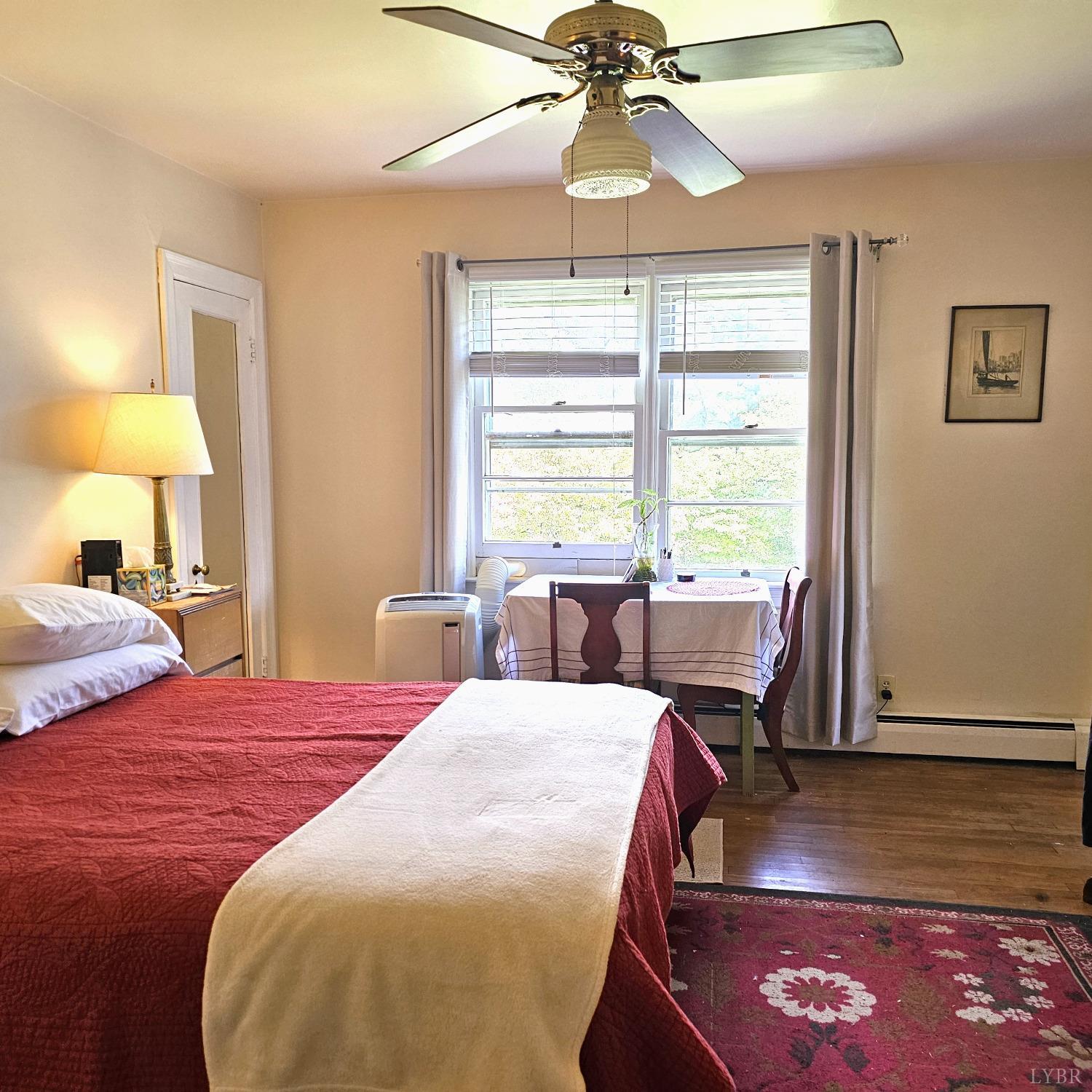 20 Peaks Road Prospect, VA 23960 - Photo 9 of 19 a bedroom with a large bed and a chandelier
