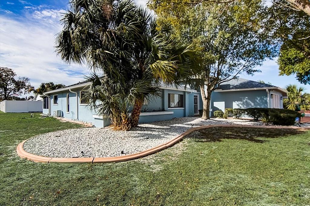 a view of house with yard