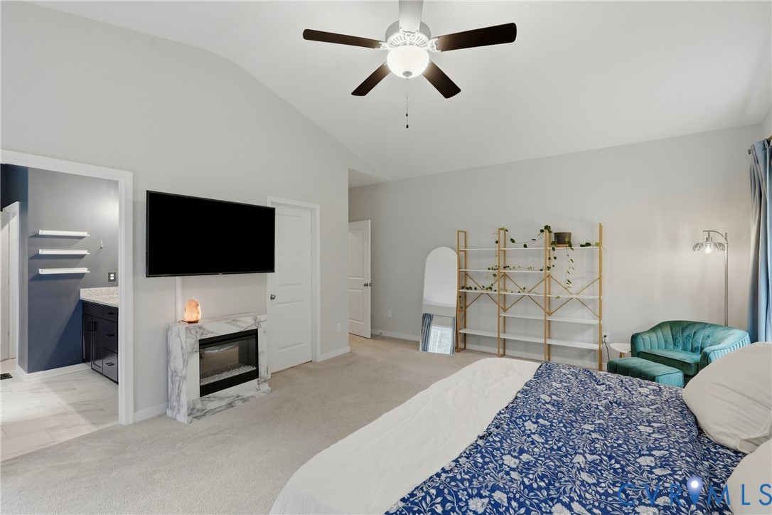 3741 Boundary Run Road Gum Spring, VA 23065 - Photo 19 of 36 Vaulted ceiling with a ceiling fan, electric firep