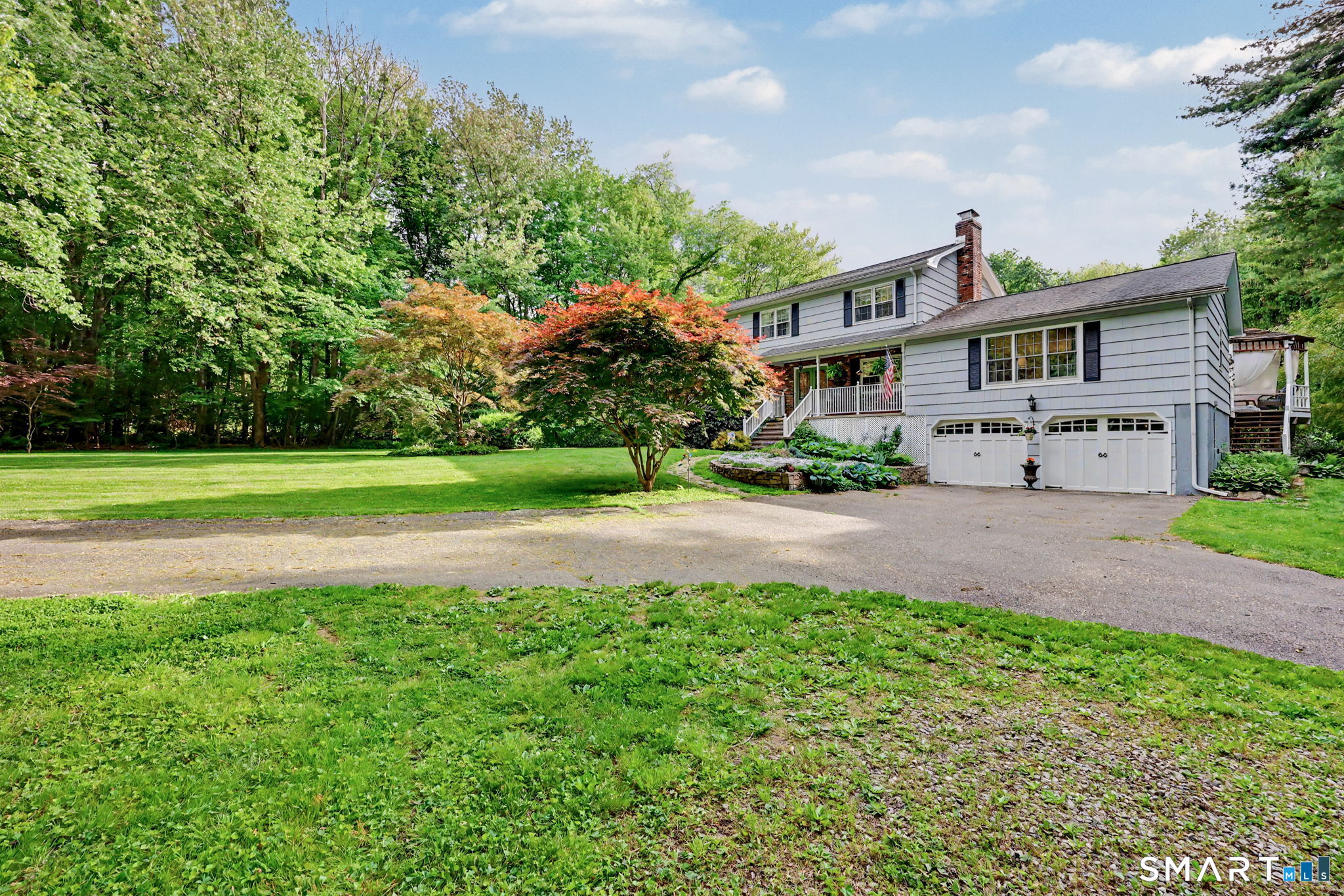 571 Wheeler Road Monroe, CT 06468 - Photo 40 of 40 a front view of a house with a yard and trees