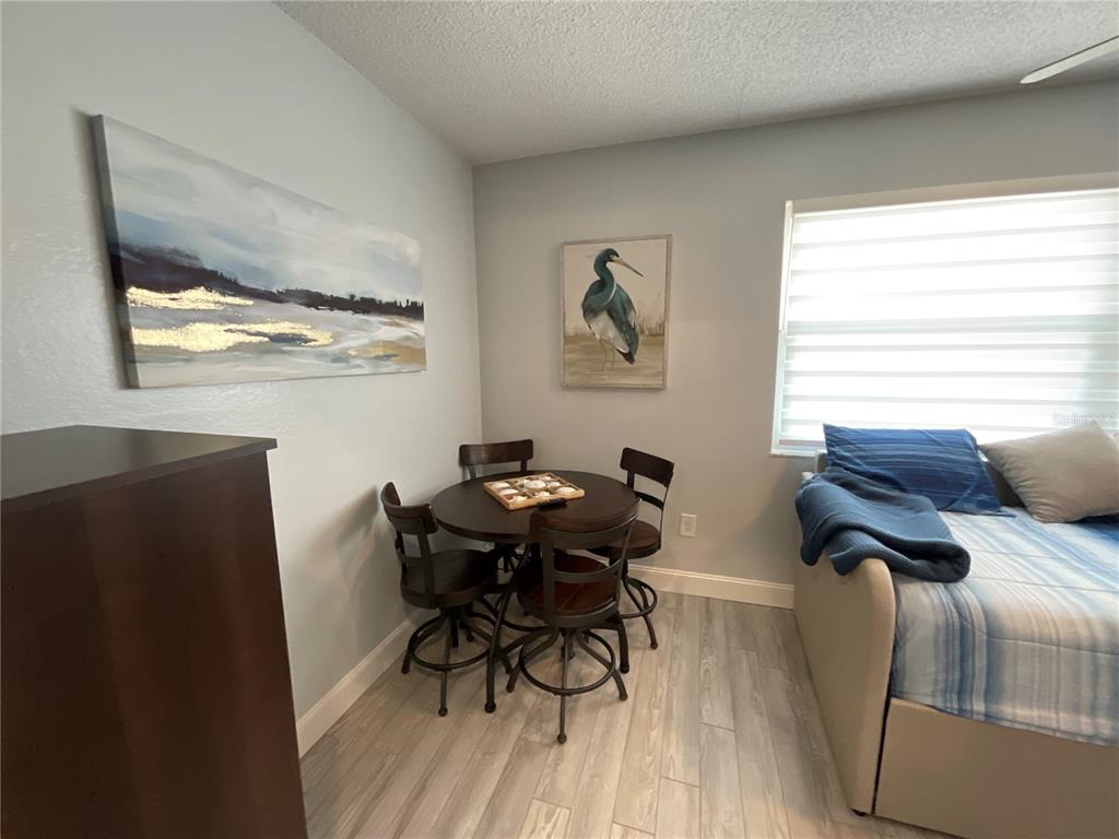 10036 63rd Avenue North, Unit 16 St. Petersburg, FL 33708 - Photo 14 of 30 a view of a workspace with furniture and a window