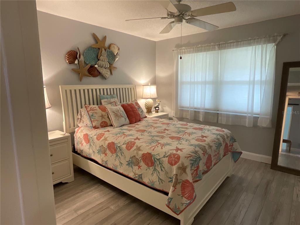 10036 63rd Avenue North, Unit 16 St. Petersburg, FL 33708 - Photo 19 of 30 a bedroom with a bed and a window