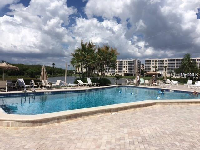 10036 63rd Avenue North, Unit 16 St. Petersburg, FL 33708 - Photo 30 of 30 a view of swimming pool and outdoor space