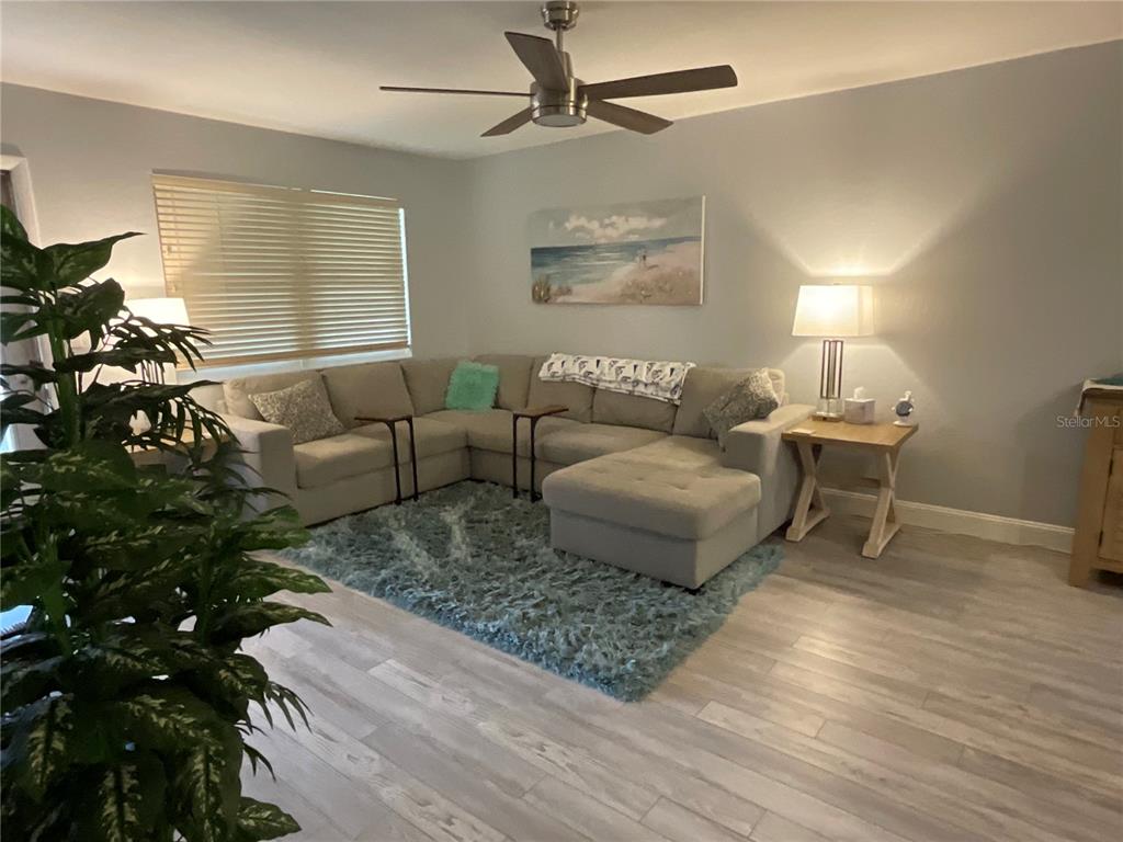 10036 63rd Avenue North, Unit 16 St. Petersburg, FL 33708 - Photo 3 of 30 a living room with furniture and a window