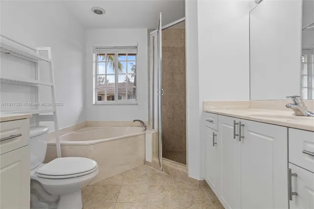 a bathroom with a sink toilet and bathtub