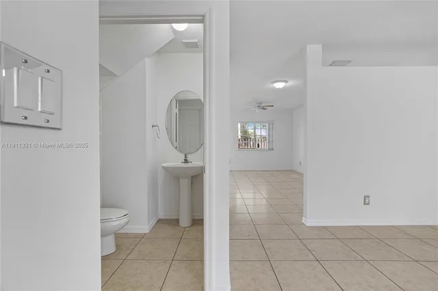 a view of a bathroom from the hallway