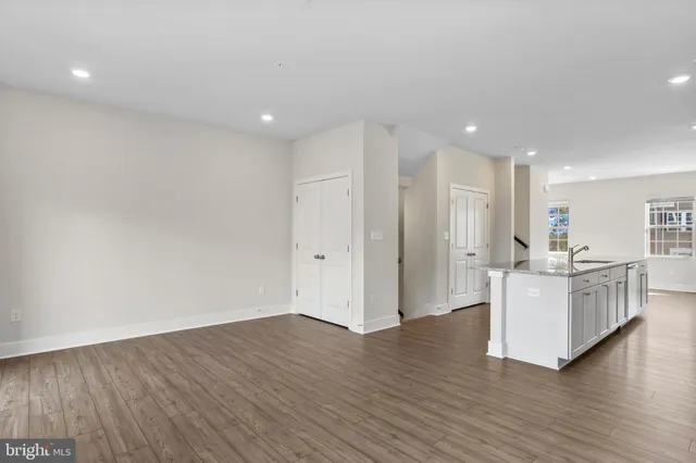 a view of kitchen with furniture and wooden floor