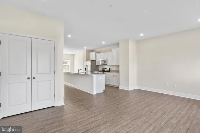 a view of kitchen view wooden floor and window