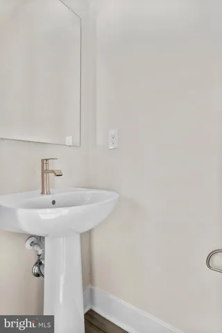 a bathroom with a sink and mirror