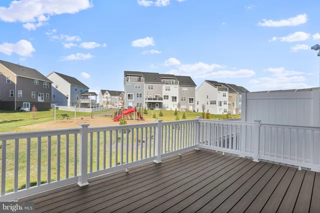 a view of a balcony with wooden floor