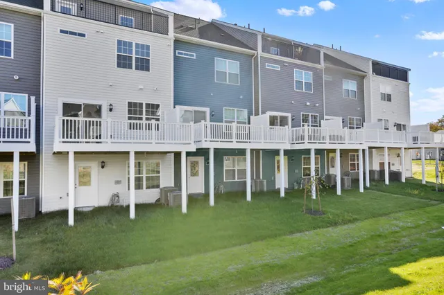 a front view of a building with a garden