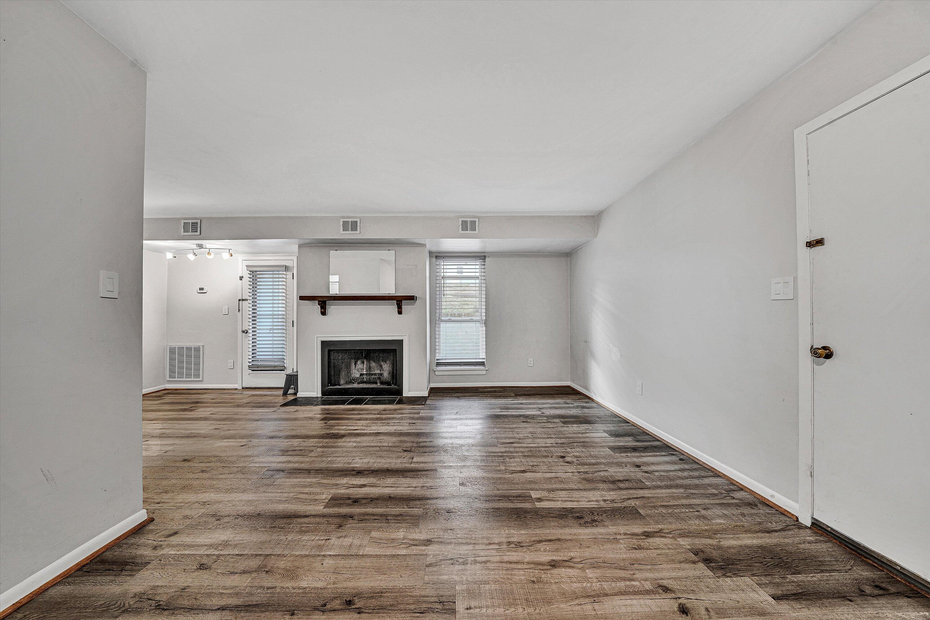 3549 Timberline Trail, Unit 149 Roanoke, VA 24018 - Photo 4 of 18 a view of a livingroom with a fireplace wooden floor and window