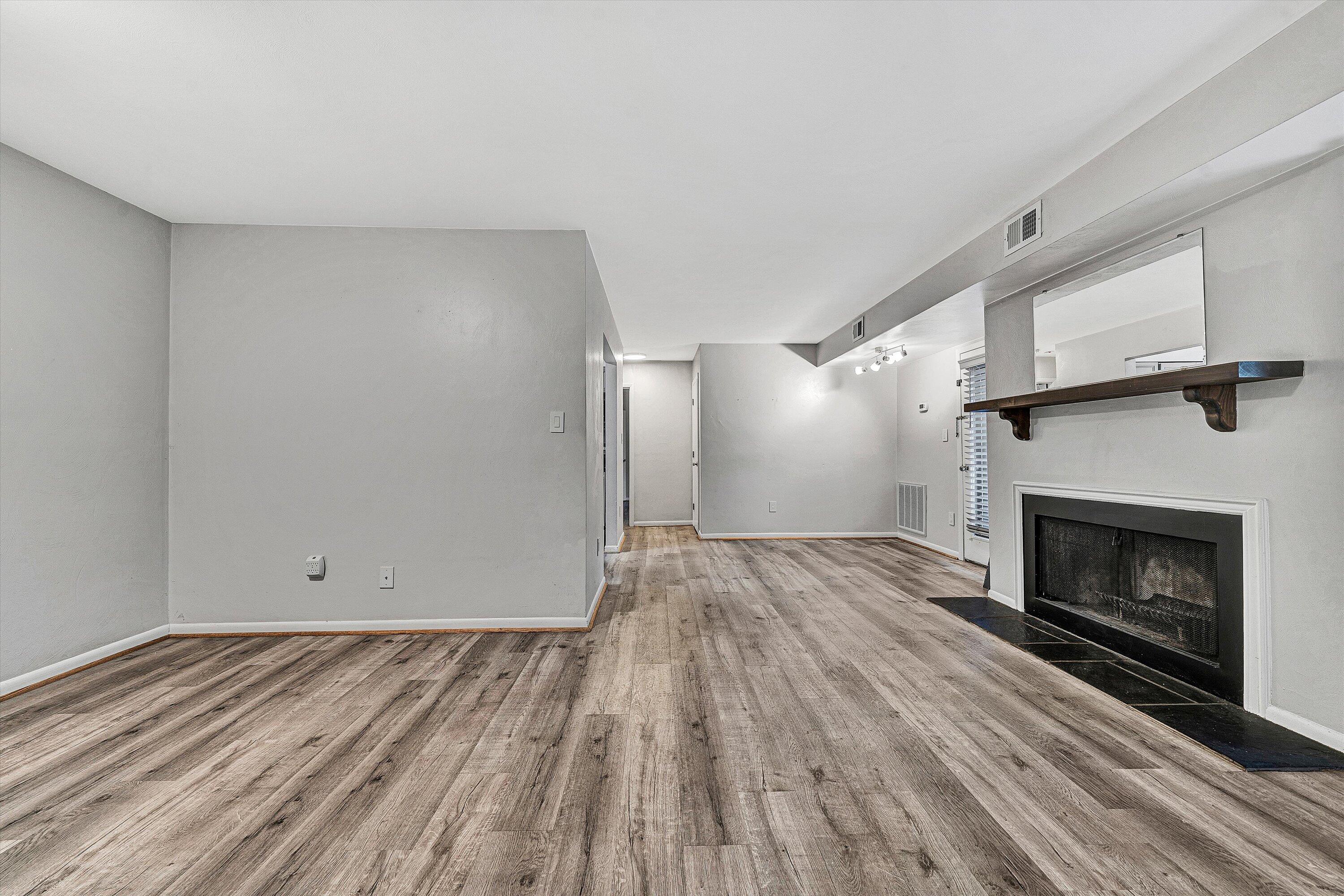 3549 Timberline Trail, Unit 149 Roanoke, VA 24018 - Photo 5 of 18 a view of empty room with wooden floor and fireplace