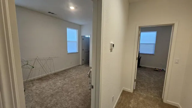 a view of hallway with natural light