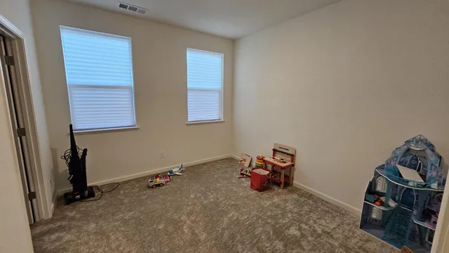 a bathroom with a sink a toilet a shower curtain and a mirror