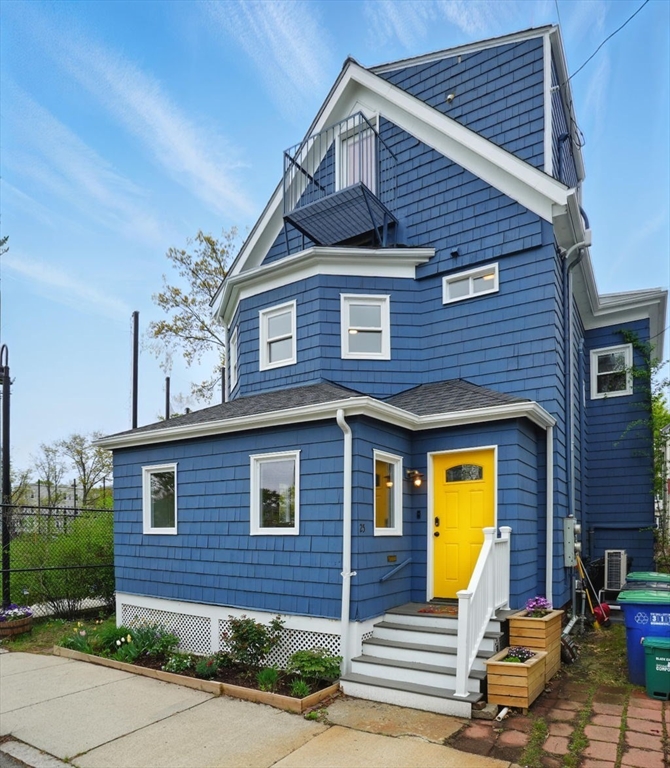 25 Bowdoin Street Somerville, MA 02143 - Photo 1 of 28 a front view of a house with a garden