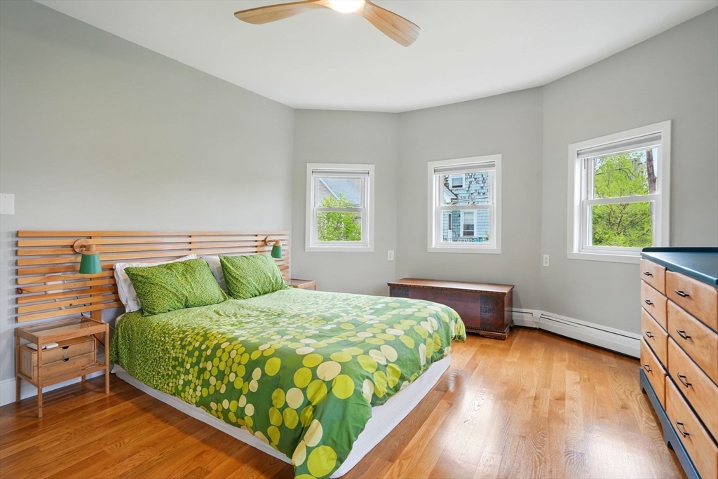 25 Bowdoin Street Somerville, MA 02143 - Photo 12 of 28 a bedroom with a bed and window