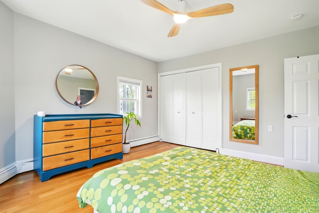 25 Bowdoin Street Somerville, MA 02143 - Photo 13 of 28 a bedroom with a bed and a dresser