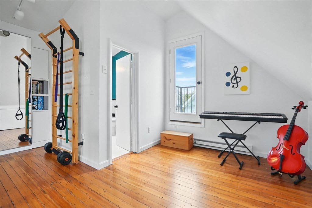 25 Bowdoin Street Somerville, MA 02143 - Photo 20 of 28 a view of a livingroom with wooden floor and furniture